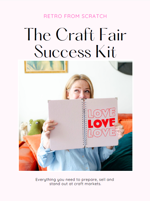 Becky Wash holding the printable Craft Fair Success Kit workbook