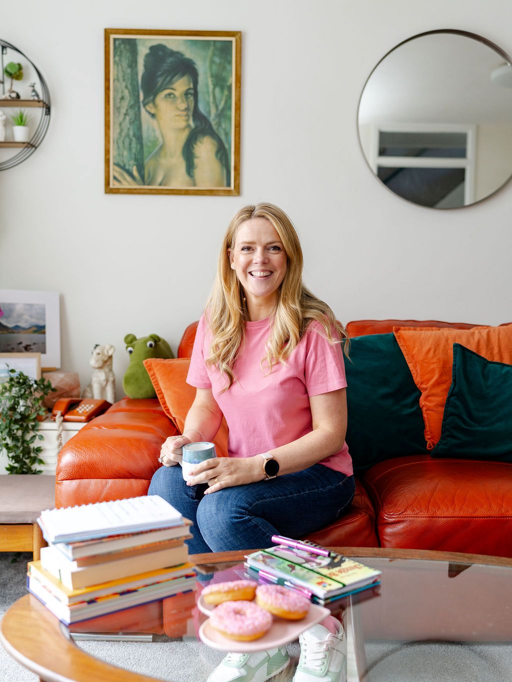 Author and craft tutor Becky Wash at home with coffee, doughnuts and a collection of books