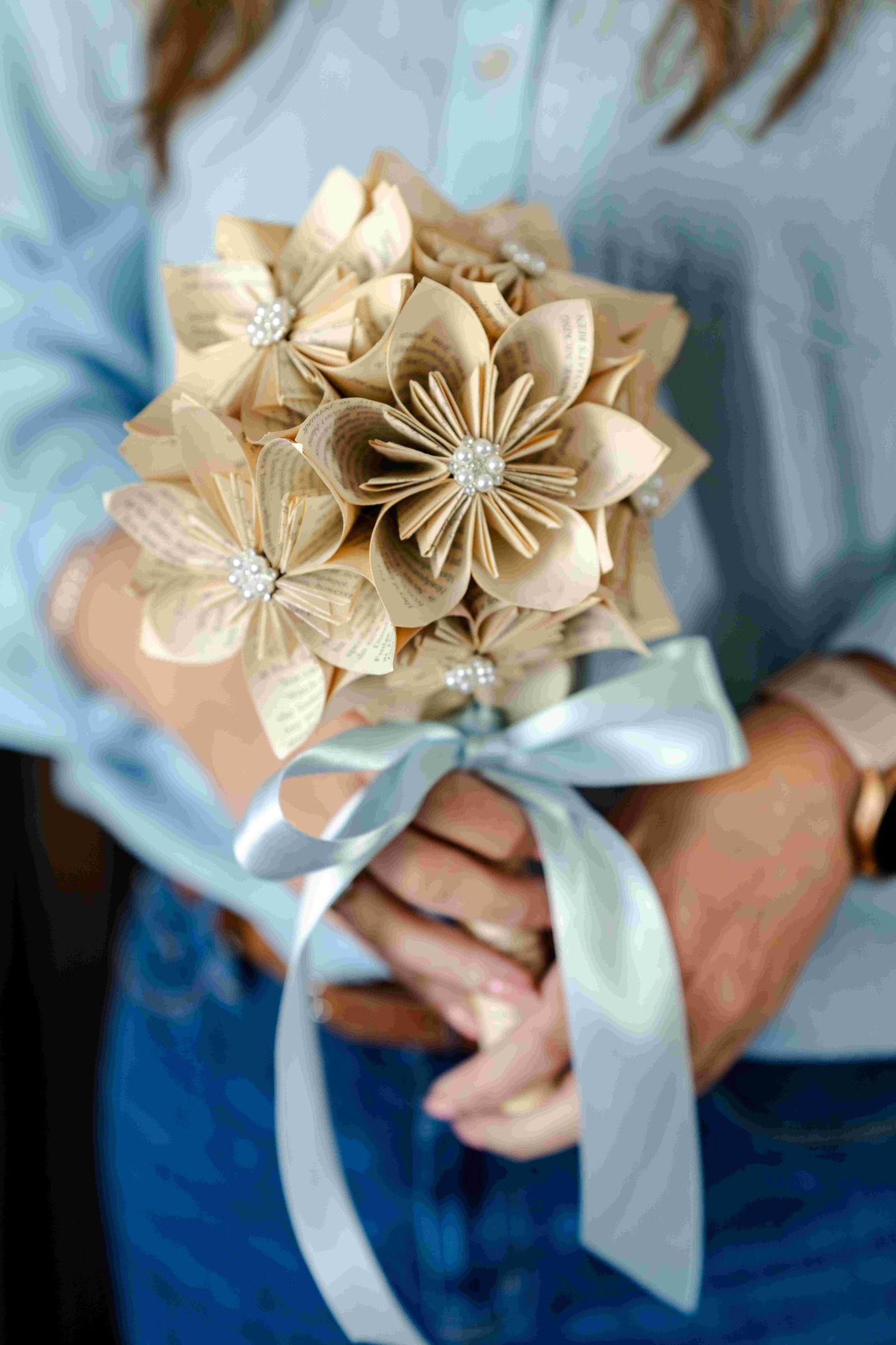 Bouquet of handmade flowers created from recycled book pages